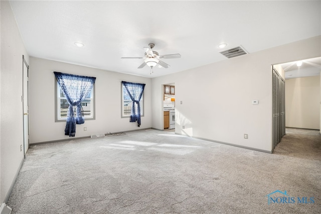 empty room with light carpet and ceiling fan