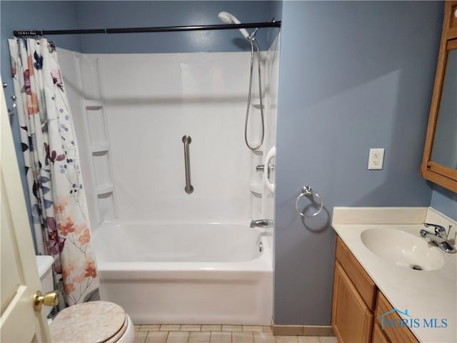 full bathroom featuring tile patterned floors, vanity, toilet, and shower / tub combo