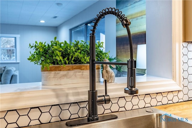 interior details featuring butcher block countertops and sink