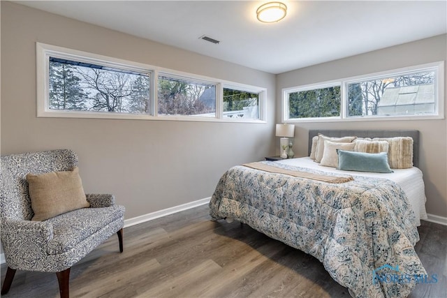 bedroom with wood-type flooring