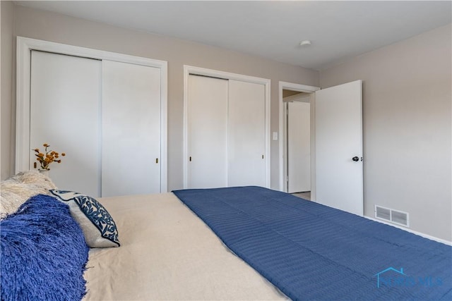 bedroom featuring two closets