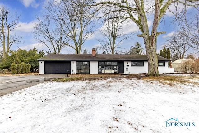 single story home with a garage