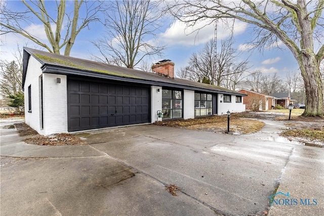 ranch-style home with a garage