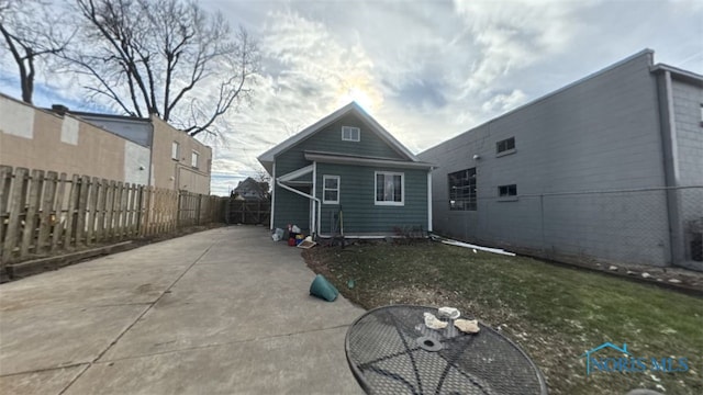 rear view of property featuring a patio