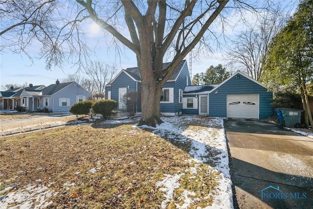 single story home featuring a garage