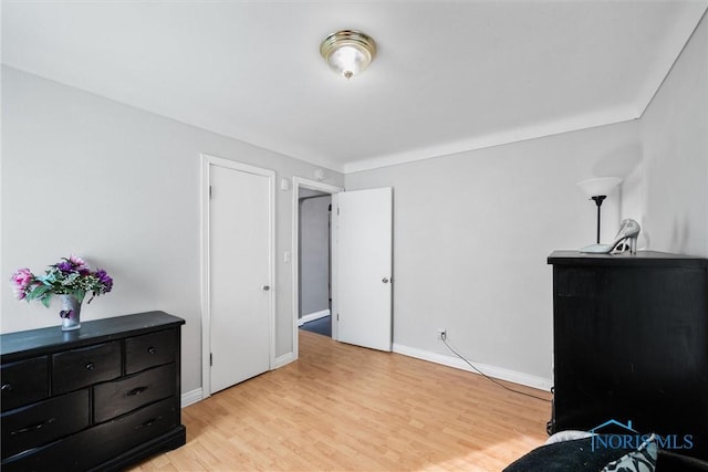 bedroom with light hardwood / wood-style flooring