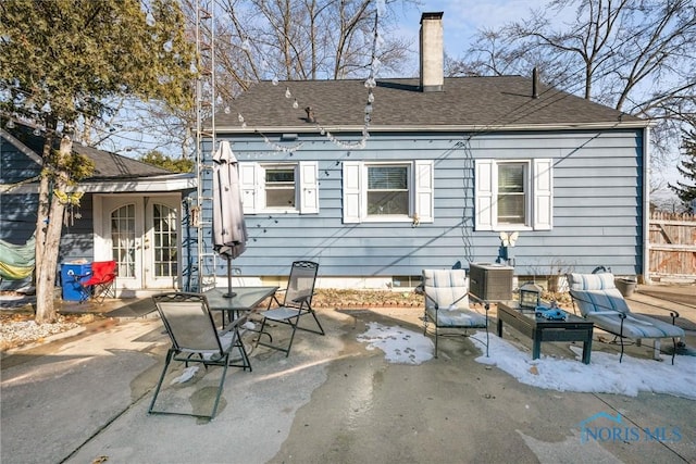 back of property featuring a patio area