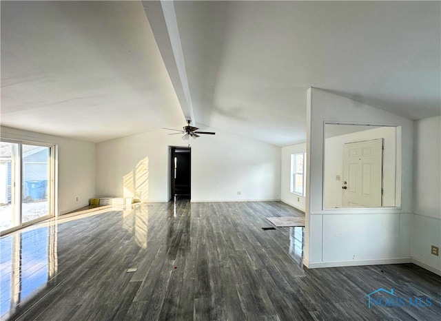 unfurnished living room with vaulted ceiling with beams, dark hardwood / wood-style floors, and ceiling fan