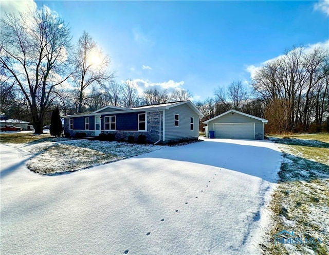 single story home with a garage and an outbuilding