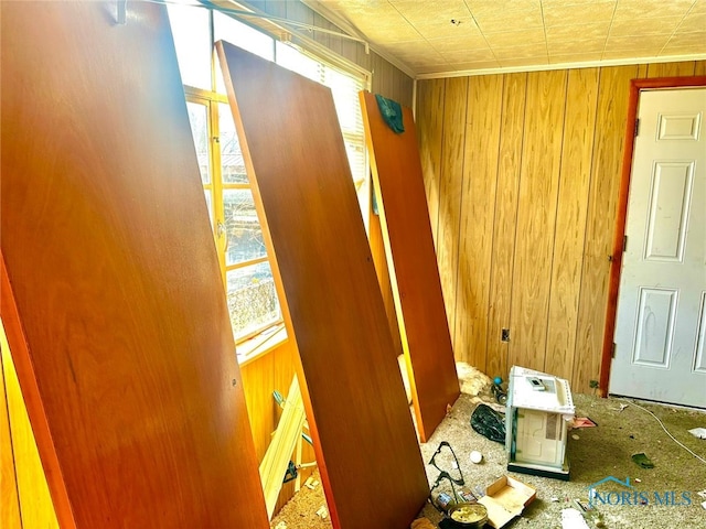 miscellaneous room featuring wooden walls