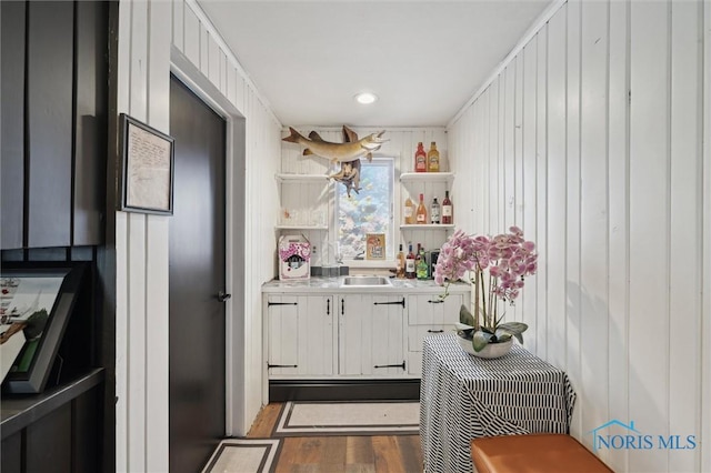 kitchen with white cabinetry and dark hardwood / wood-style floors