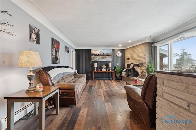 living room featuring baseboard heating and wood-type flooring