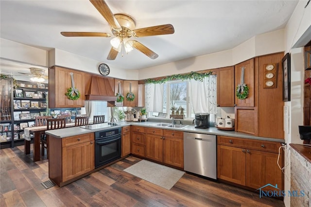 kitchen featuring sink, dark wood-type flooring, ceiling fan, black appliances, and custom range hood