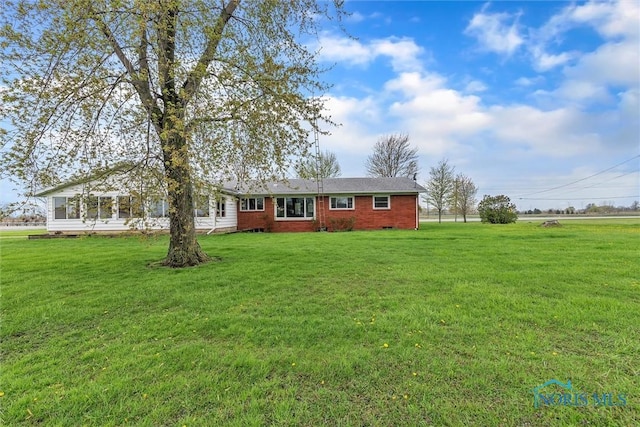 single story home with a front yard