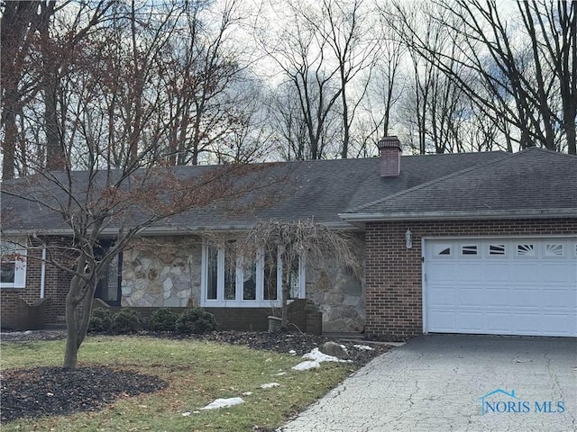 ranch-style home with a garage