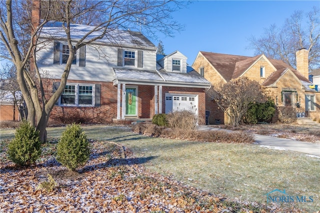 view of front of home with a garage and a front yard