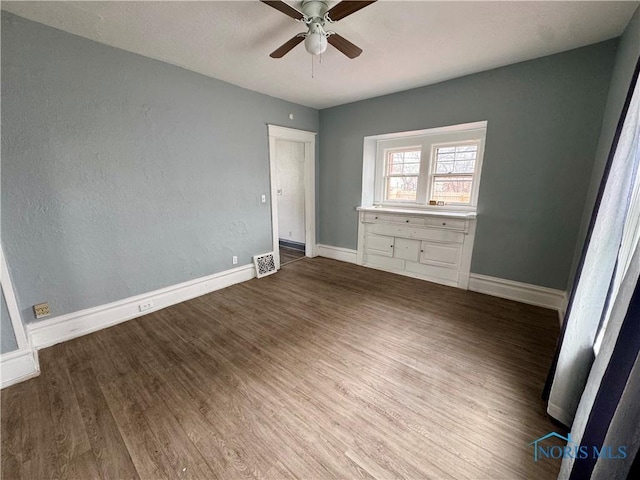 unfurnished bedroom featuring ceiling fan and hardwood / wood-style floors