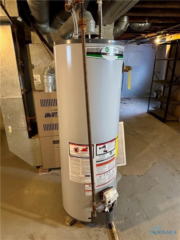 utility room featuring gas water heater