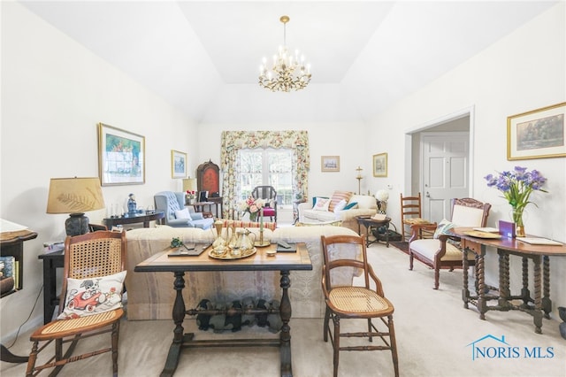 living room with light carpet and a chandelier