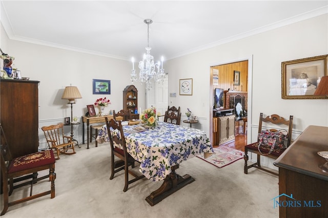 dining area with light carpet, a notable chandelier, and crown molding