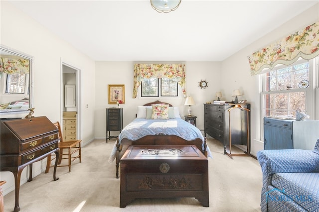 bedroom featuring multiple windows and light carpet