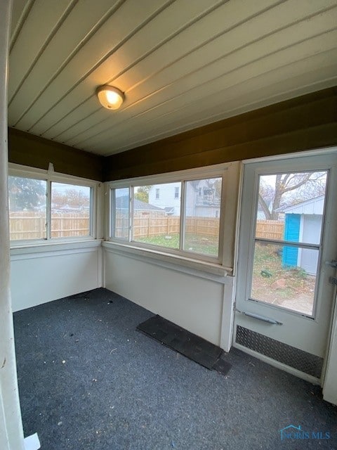 unfurnished sunroom featuring plenty of natural light