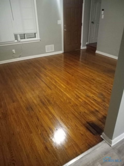 spare room featuring hardwood / wood-style flooring