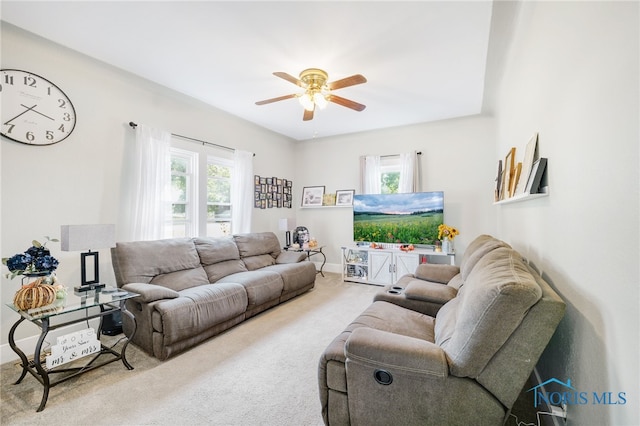 living room featuring ceiling fan and carpet flooring