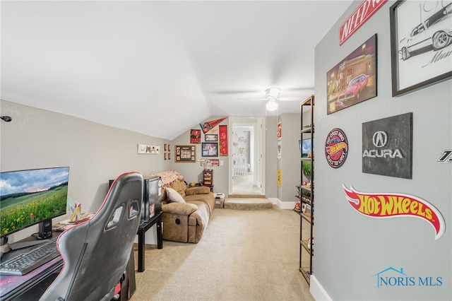 carpeted home office featuring ceiling fan and lofted ceiling