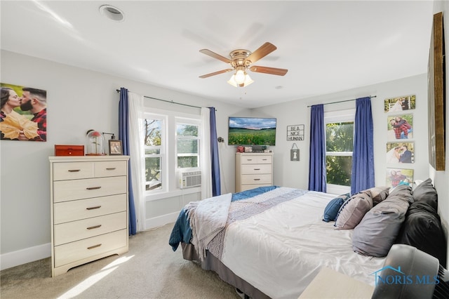 bedroom featuring light colored carpet and ceiling fan