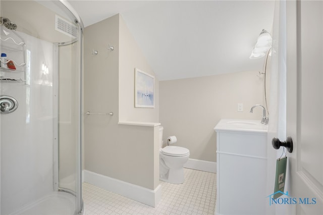 bathroom featuring vanity, toilet, an enclosed shower, and vaulted ceiling