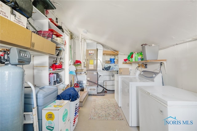 clothes washing area with sink and washer and clothes dryer