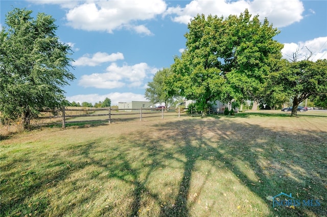 view of yard with a rural view