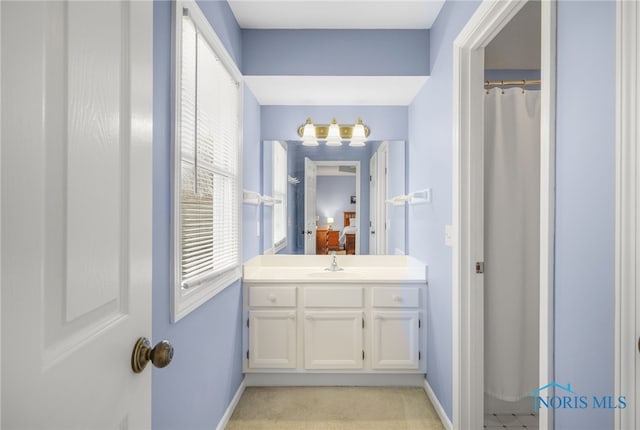 bathroom featuring vanity and walk in shower