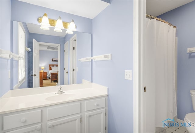 bathroom with vanity and toilet