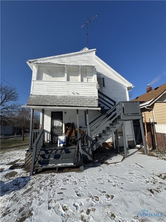 view of snow covered house