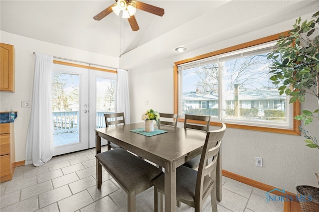 dining space featuring lofted ceiling, french doors, and ceiling fan