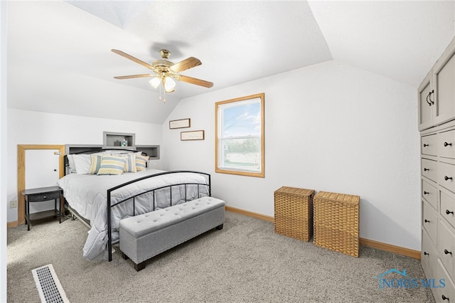 carpeted bedroom featuring vaulted ceiling and ceiling fan