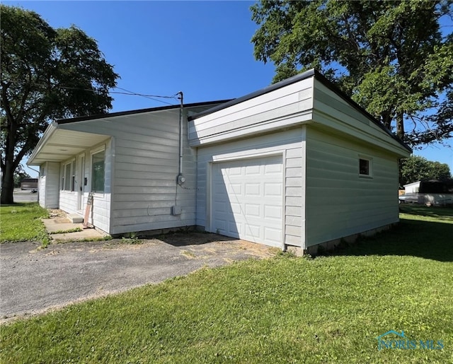 garage with a lawn