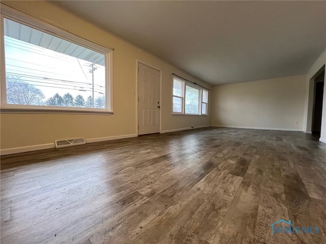 interior space with dark hardwood / wood-style floors