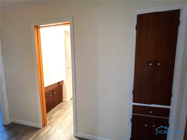 hallway featuring light hardwood / wood-style flooring