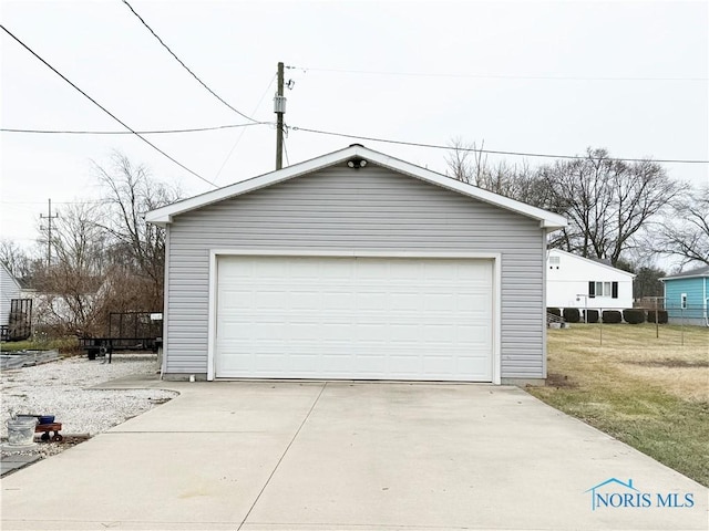 garage featuring a lawn