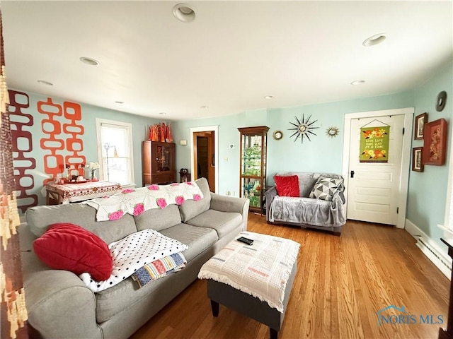 living room featuring a wealth of natural light and wood-type flooring