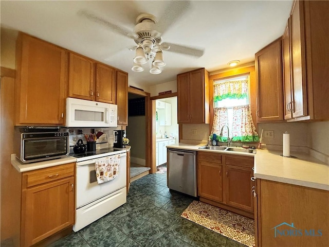 kitchen with ceiling fan, white appliances, and sink