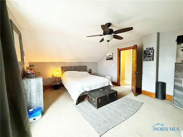 carpeted bedroom with ceiling fan and lofted ceiling