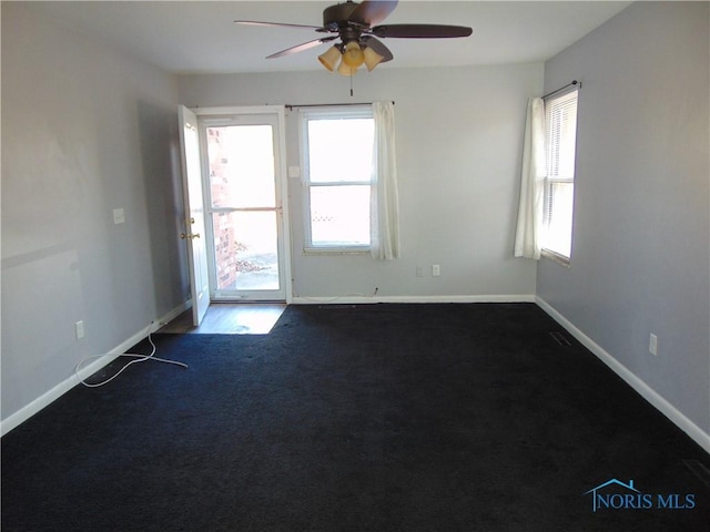 carpeted empty room featuring ceiling fan