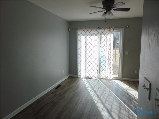 unfurnished room featuring hardwood / wood-style flooring and ceiling fan