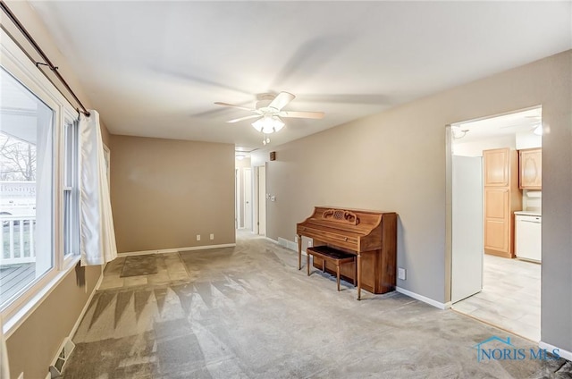 miscellaneous room with light carpet and ceiling fan