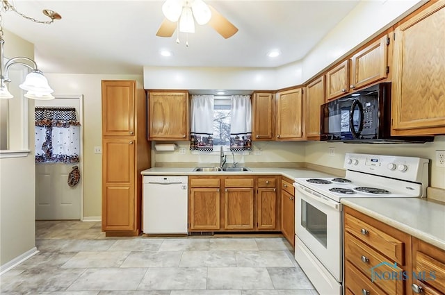 kitchen featuring ceiling fan, sink, white appliances, and decorative light fixtures