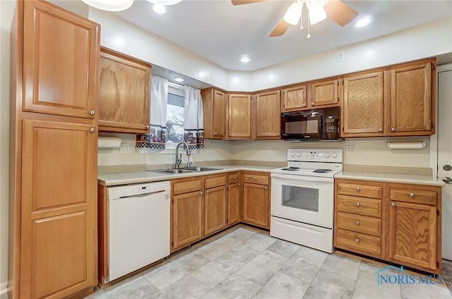 kitchen featuring sink, white appliances, and ceiling fan